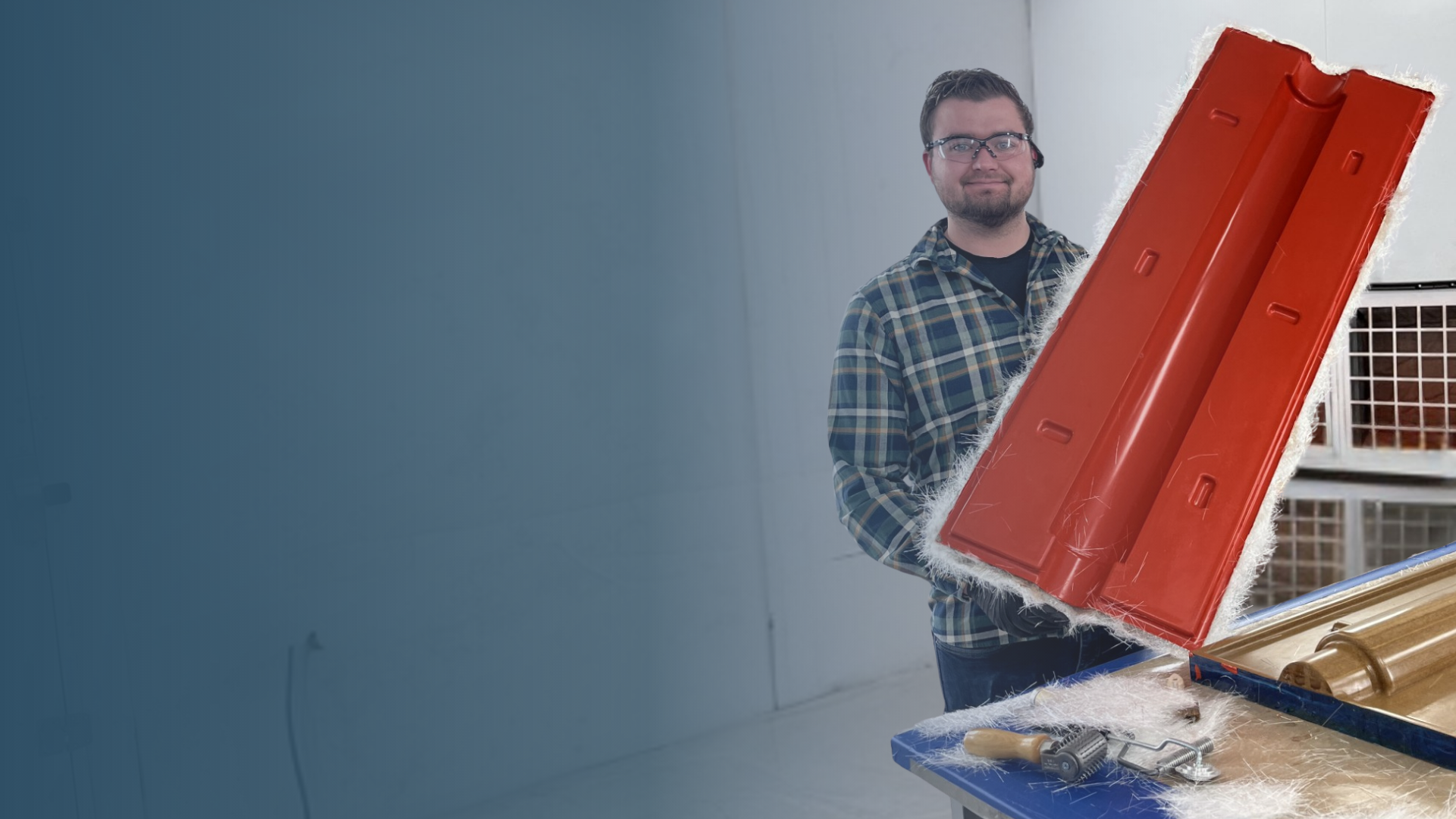 River Stormo holding a rocket mold with blue overlay